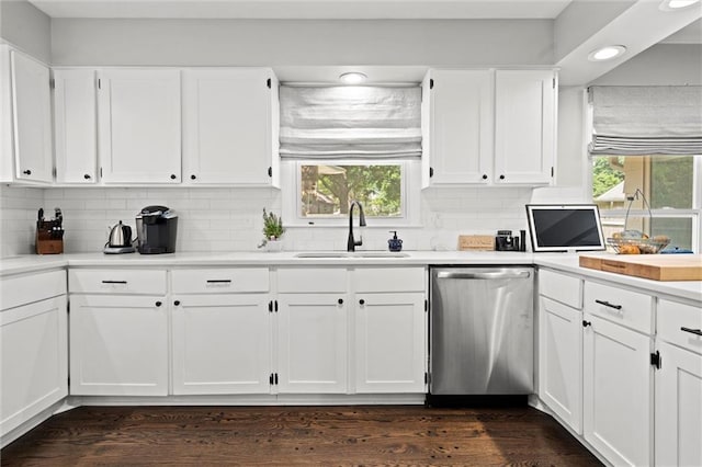 101 W 116th St, Kansas City, MO 64114 - kitchen featuring stainless steel dishwasher, recessed lighting, white cabinetry, decorative backsplash, and light countertops