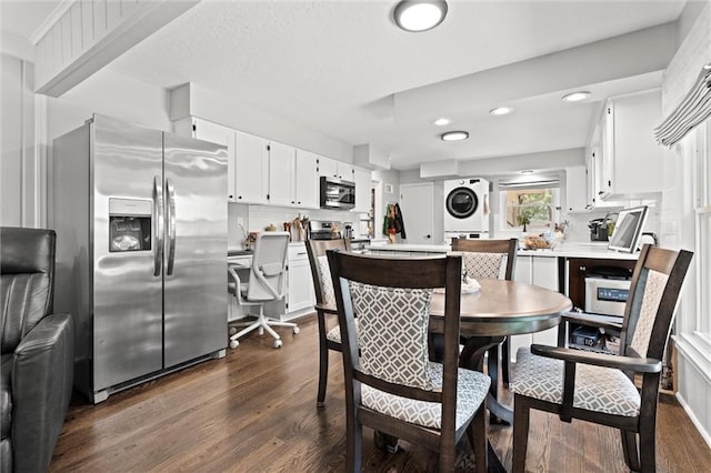 101 W 116th St, Kansas City, MO 64114 - dining area with stacked washer / drying machine, dark wood-style flooring, and recessed lighting