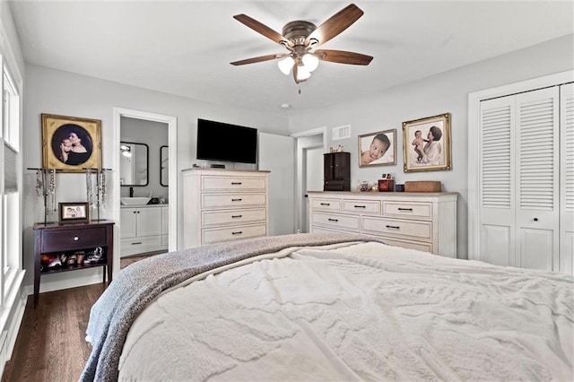 101 W 116th St, Kansas City, MO 64114 - bedroom featuring a closet, dark wood finished floors, ceiling fan, and ensuite bath