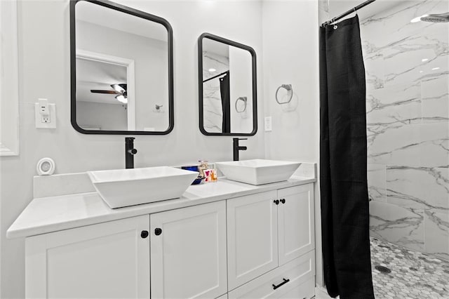 101 W 116th St, Kansas City, MO 64114 - full bathroom featuring a marble finish shower, double vanity, and a ceiling fan