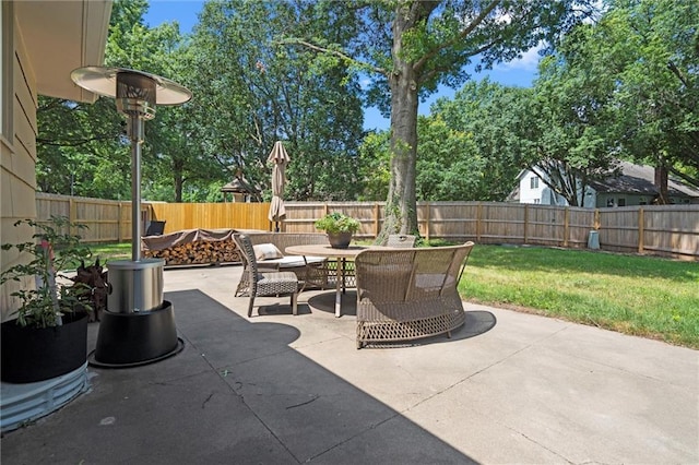 101 W 116th St, Kansas City, MO 64114 - fenced backyard featuring an outdoor fire pit, outdoor dining space, and a patio area