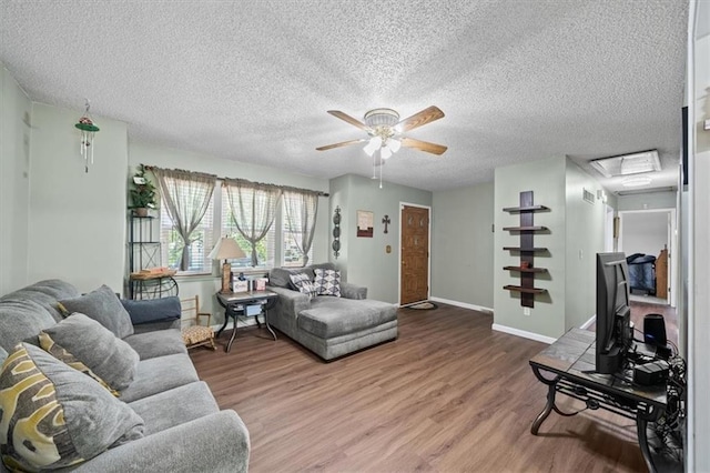 406 Crescent St, Lees Summit, MO 64063 - living room featuring ceiling fan, wood finished floors, and a textured ceiling