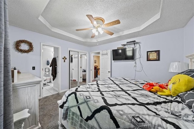 406 Crescent St, Lees Summit, MO 64063 - bedroom featuring a textured ceiling, a raised ceiling, carpet flooring, ceiling fan, and a closet