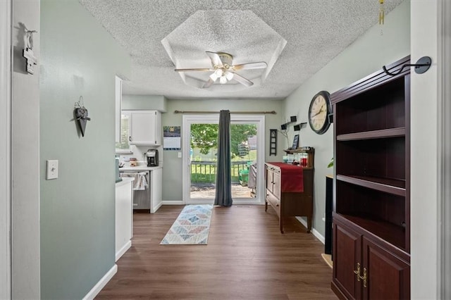406 Crescent St, Lees Summit, MO 64063 - foyer featuring a ceiling fan, dark wood-type flooring, and a textured ceiling