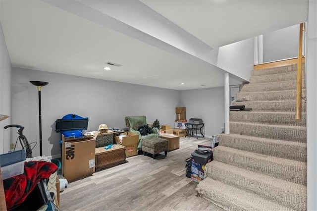 406 Crescent St, Lees Summit, MO 64063 - finished basement with stairway, wood finished floors, and recessed lighting