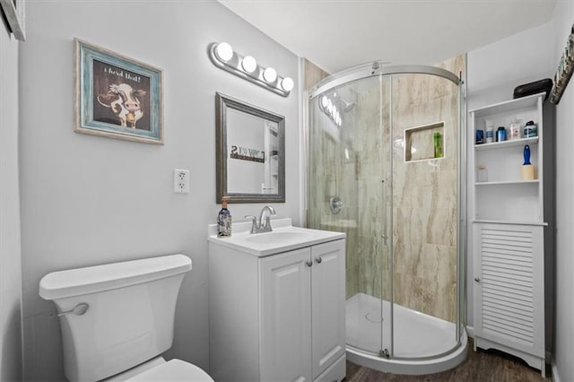 406 Crescent St, Lees Summit, MO 64063 - bathroom featuring vanity, a stall shower, and wood finished floors