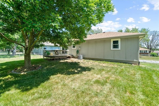 406 Crescent St, Lees Summit, MO 64063 - back of house featuring board and batten siding and a deck