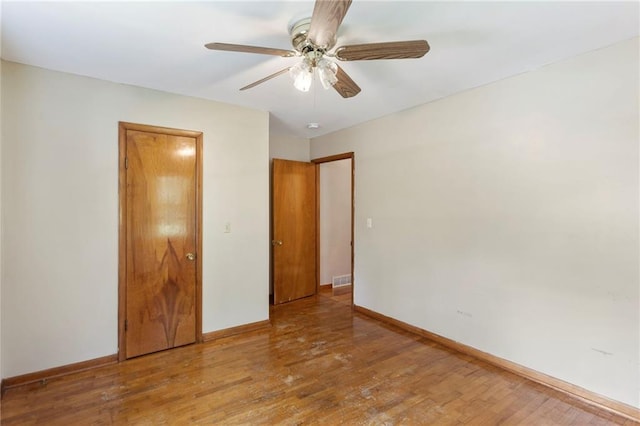 35365 Block Rd, Paola, KS 66071 - unfurnished bedroom featuring wood finished floors and ceiling fan