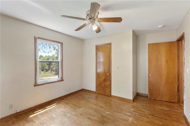 35365 Block Rd, Paola, KS 66071 - unfurnished bedroom with wood finished floors and a ceiling fan