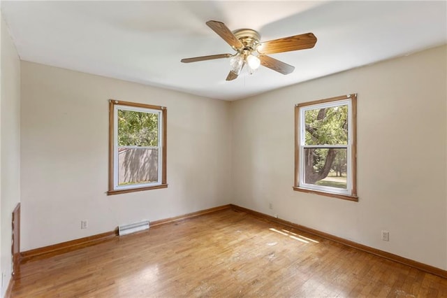 35365 Block Rd, Paola, KS 66071 - empty room featuring plenty of natural light, hardwood / wood-style floors, and a ceiling fan
