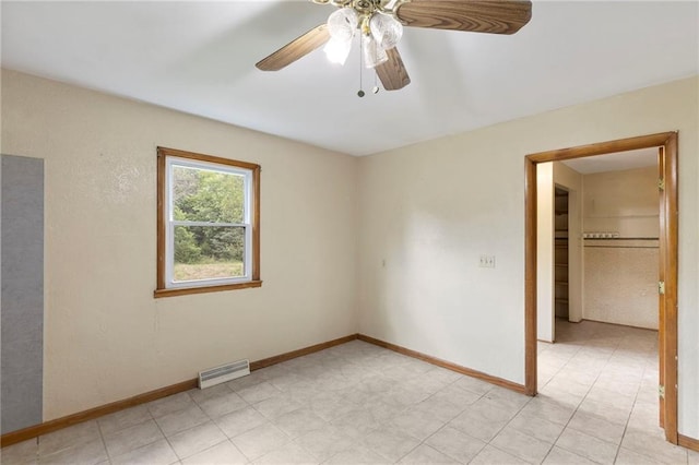 35365 Block Rd, Paola, KS 66071 - spare room with baseboards and a ceiling fan