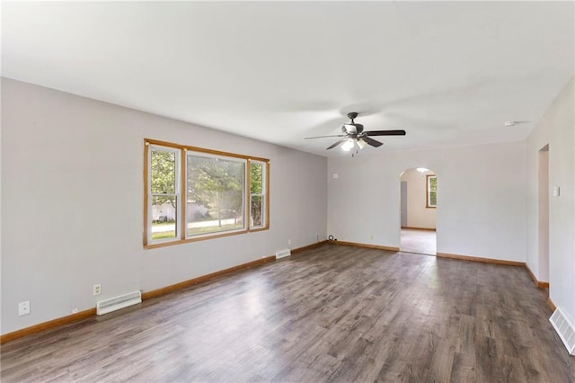 35365 Block Rd, Paola, KS 66071 - spare room with arched walkways, a ceiling fan, and wood finished floors