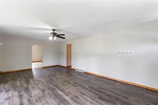 35365 Block Rd, Paola, KS 66071 - unfurnished room featuring arched walkways, a ceiling fan, and wood finished floors
