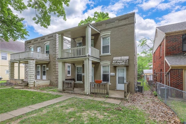 336 N 16th St, Kansas City, KS 66102 - townhome / multi-family property featuring a balcony and brick siding