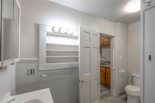 336 N 16th St, Kansas City, KS 66102 - bathroom with vanity and wood finished floors