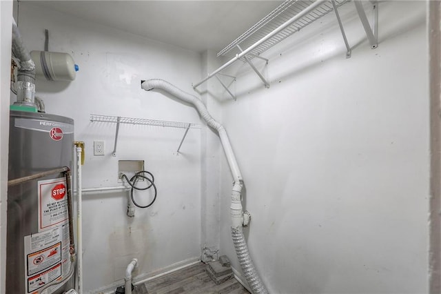 336 N 16th St, Kansas City, KS 66102 - interior space featuring gas water heater and wood finished floors