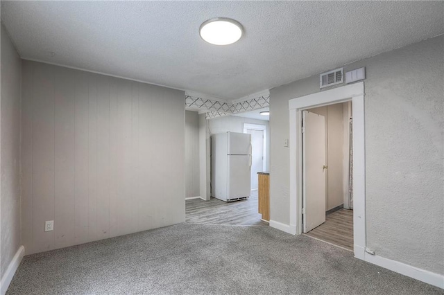 336 N 16th St, Kansas City, KS 66102 - unfurnished room with light colored carpet and a textured ceiling