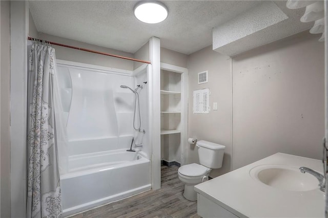336 N 16th St, Kansas City, KS 66102 - full bathroom with wood finished floors, shower / bath combination with curtain, a textured ceiling, and vanity