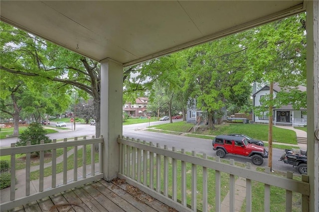 336 N 16th St, Kansas City, KS 66102 - wooden porch featuring a residential view
