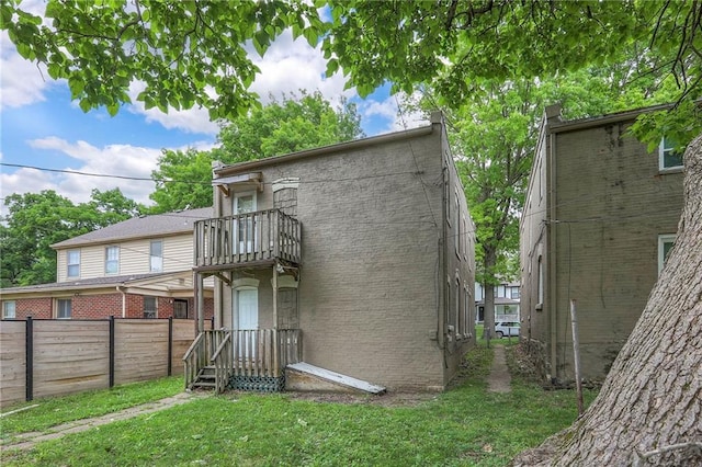 336 N 16th St, Kansas City, KS 66102 - back of property with a balcony and brick siding