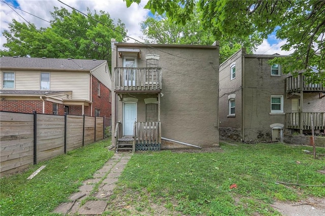 336 N 16th St, Kansas City, KS 66102 - back of property featuring a balcony and brick siding
