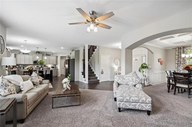 24631 W 126th St, Olathe, KS 66061 - living room featuring stairs, ceiling fan, arched walkways, wainscoting, and recessed lighting