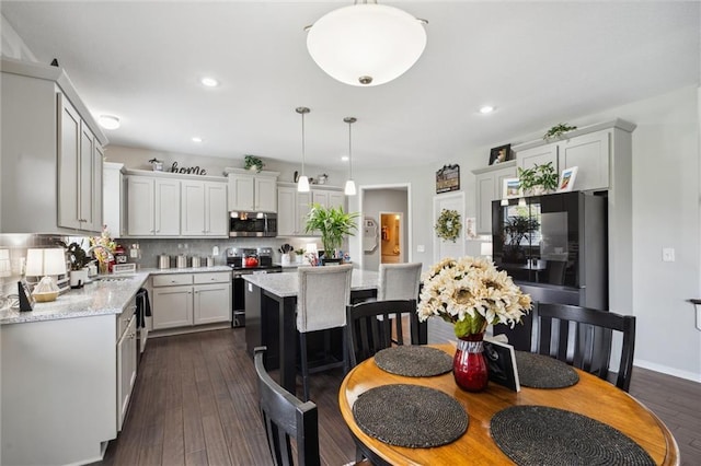 24631 W 126th St, Olathe, KS 66061 - kitchen featuring stainless steel appliances, tasteful backsplash, hanging light fixtures, recessed lighting, and a center island