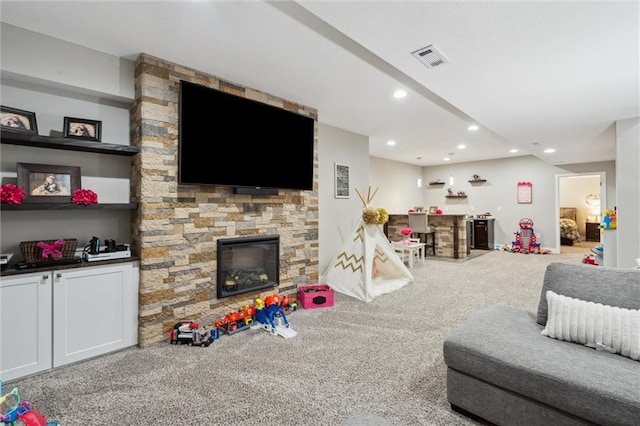 24631 W 126th St, Olathe, KS 66061 - living room featuring a stone fireplace, carpet flooring, and recessed lighting