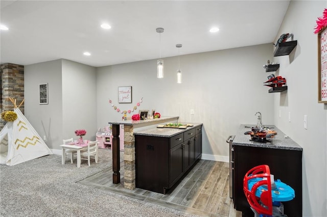 24631 W 126th St, Olathe, KS 66061 - kitchen featuring recessed lighting, a peninsula, pendant lighting, light wood-style flooring, and light countertops