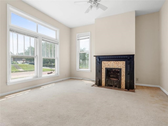 2703 Olive St, Saint Joseph, MO 64507 - unfurnished living room with a fireplace with flush hearth, carpet, and a ceiling fan