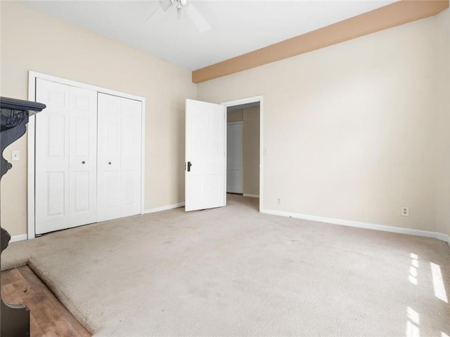 2703 Olive St, Saint Joseph, MO 64507 - unfurnished bedroom with light carpet, a closet, and ceiling fan