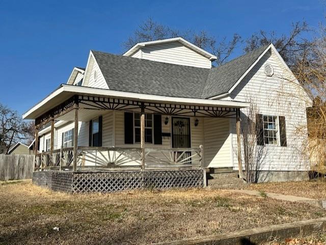 526 S W St, Nevada, MO 64772 - view of front of house with a porch and roof with shingles