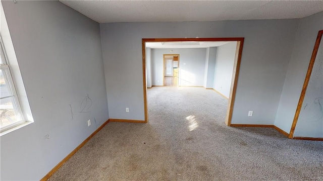 526 S W St, Nevada, MO 64772 - carpeted empty room with plenty of natural light