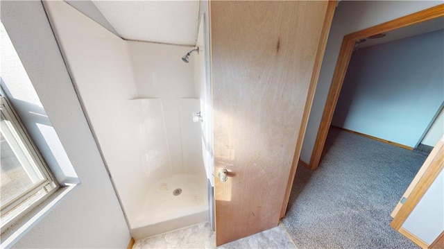 526 S W St, Nevada, MO 64772 - bathroom with a shower stall and baseboards