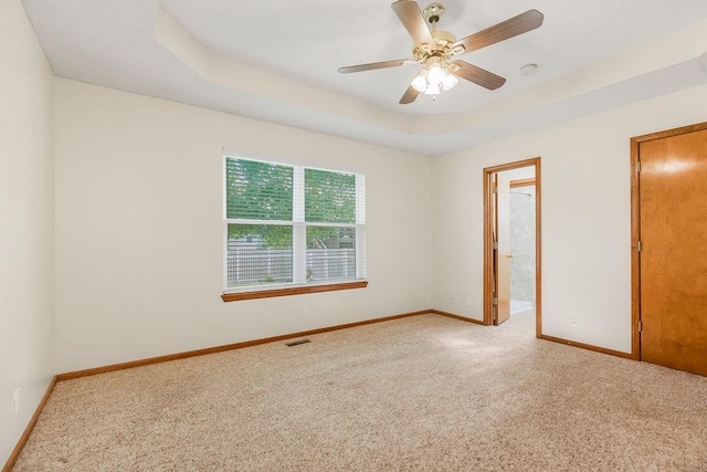 321 W Mockingbird St, Gardner, KS 66030 - unfurnished bedroom with carpet flooring, a raised ceiling, and ceiling fan