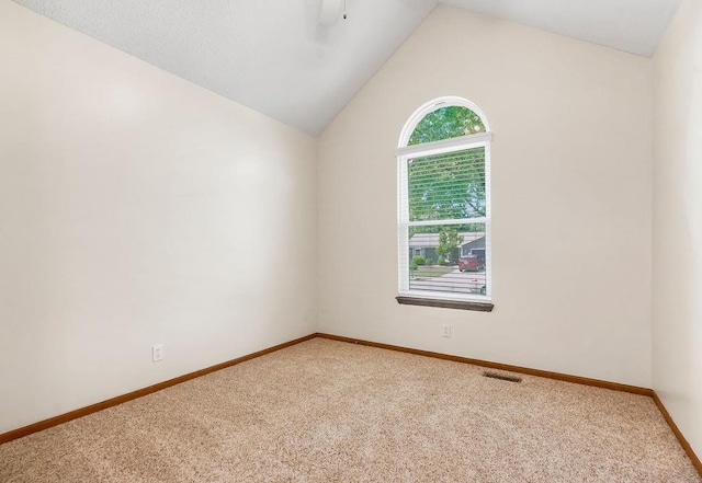 321 W Mockingbird St, Gardner, KS 66030 - empty room with light carpet, lofted ceiling, and a ceiling fan
