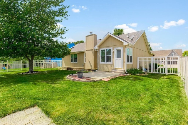 321 W Mockingbird St, Gardner, KS 66030 - back of house featuring a fenced backyard, a patio, and a chimney