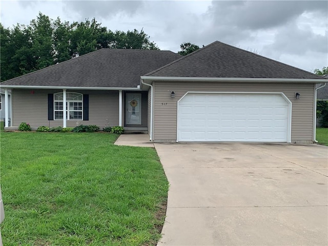 517 Brooklyn Ct, Frontenac, KS 66763 - view of front of home with concrete driveway, a garage, a front yard, and roof with shingles