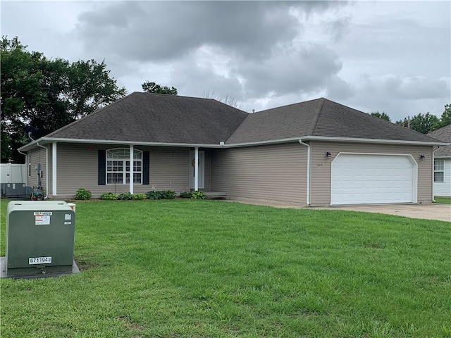 517 Brooklyn Ct, Frontenac, KS 66763 - view of front of house with an attached garage, a front yard, a shingled roof, and driveway