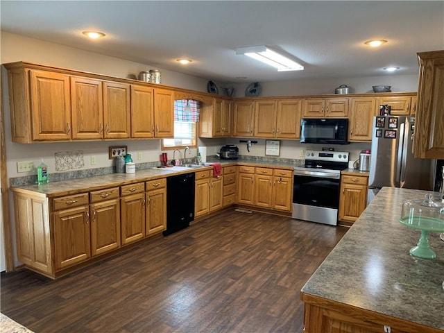 517 Brooklyn Ct, Frontenac, KS 66763 - kitchen with black appliances, dark wood-style floors, and brown cabinetry