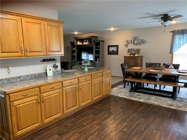 517 Brooklyn Ct, Frontenac, KS 66763 - kitchen with dark wood finished floors, a ceiling fan, and brown cabinetry