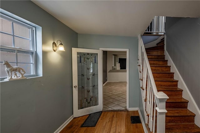 3620 Smart Ave, Kansas City, MO 64124 - foyer entrance with stairs and wood finished floors