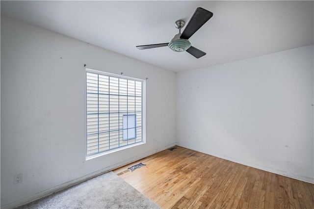 3620 Smart Ave, Kansas City, MO 64124 - unfurnished room with ceiling fan and wood finished floors