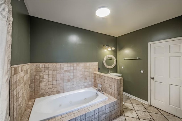 3620 Smart Ave, Kansas City, MO 64124 - full bathroom featuring a tub with jets and tile patterned flooring