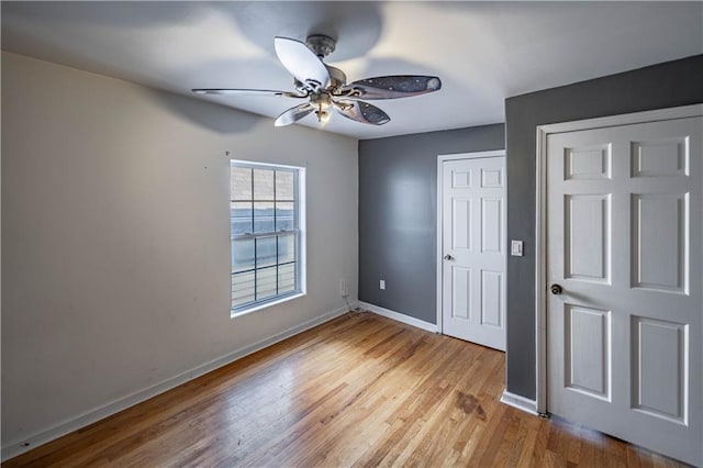 3620 Smart Ave, Kansas City, MO 64124 - unfurnished bedroom featuring wood finished floors and a ceiling fan
