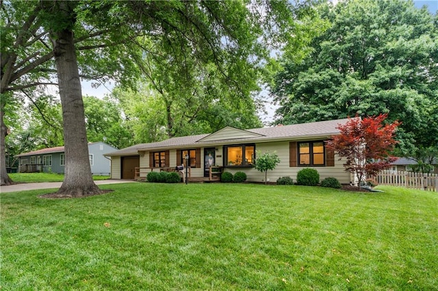 8039 Kessler St, Overland Park, KS 66204 - ranch-style house featuring a garage, concrete driveway, and covered porch
