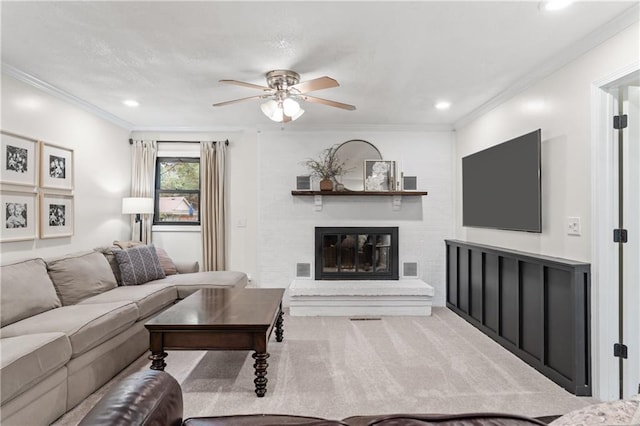 8039 Kessler St, Overland Park, KS 66204 - living area with ceiling fan, ornamental molding, carpet flooring, a fireplace, and recessed lighting