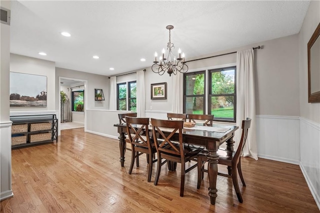 8039 Kessler St, Overland Park, KS 66204 - dining room featuring wainscoting, light wood-type flooring, a chandelier, and recessed lighting