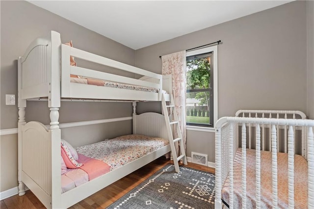 8039 Kessler St, Overland Park, KS 66204 - bedroom with wood finished floors and baseboards