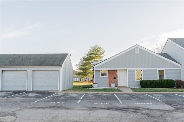 911 SE Hampton Ct, Lees Summit, MO 64063 - view of building exterior with uncovered parking
